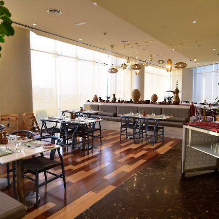 Grand Millennium Muscat Hotel Exterior foto The restaurant