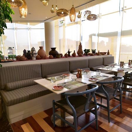 Grand Millennium Muscat Hotel Exterior foto The interior of the restaurant