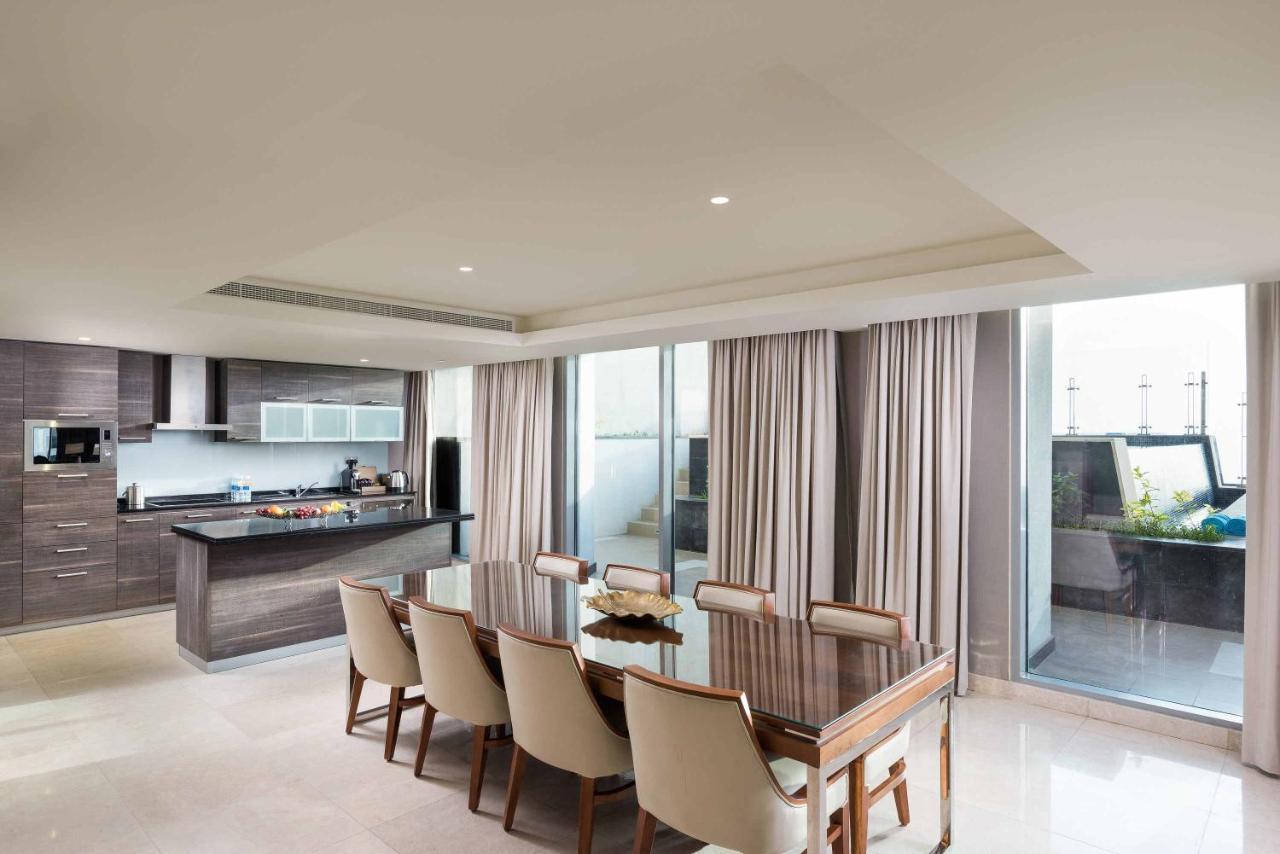 Grand Millennium Muscat Hotel Exterior foto A typical apartment interior