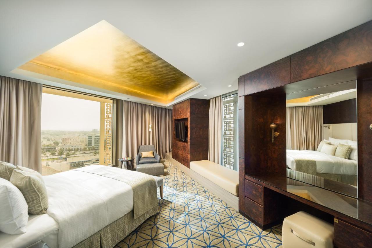 Grand Millennium Muscat Hotel Exterior foto A suite at the hotel
