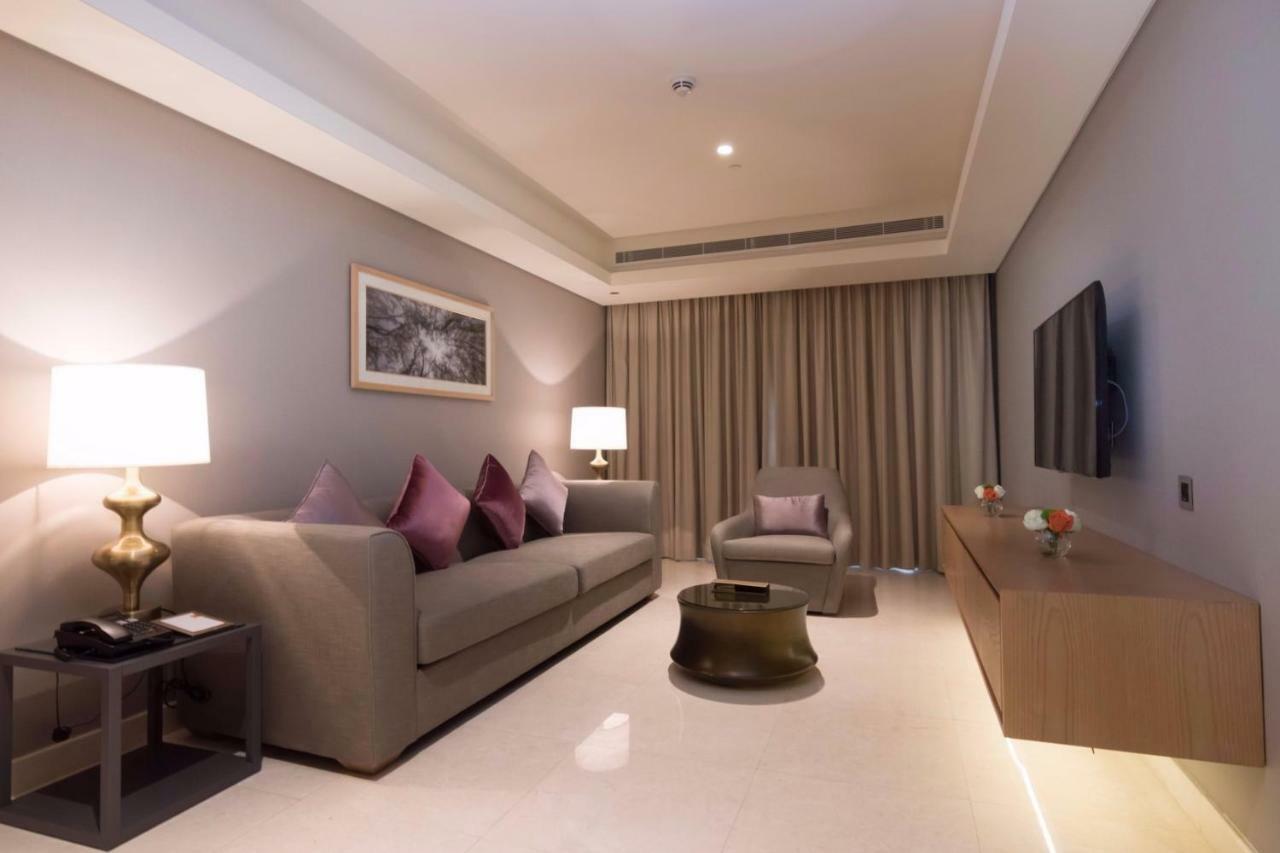 Grand Millennium Muscat Hotel Exterior foto Living room